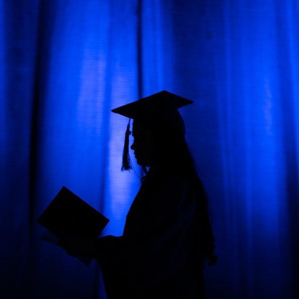Silhouette of a graduate at the Laker Graduation Celebration